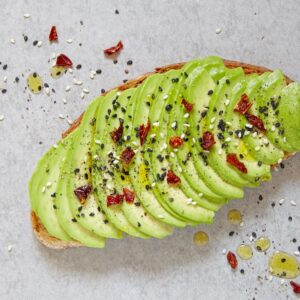 Sliced up avocado on a piece of toast