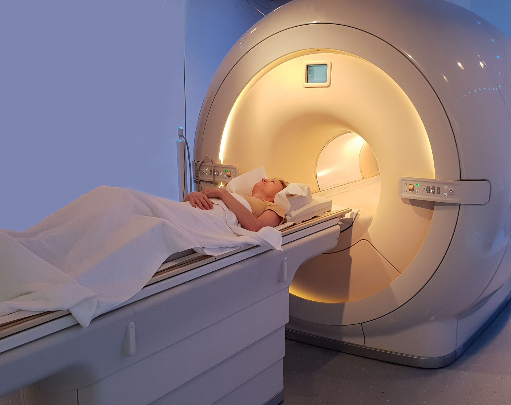 A person calmly undergoing an MRI scan, demonstrating strategies for managing anxiety and staying relaxed during an MRI when you have Multiple Sclerosis