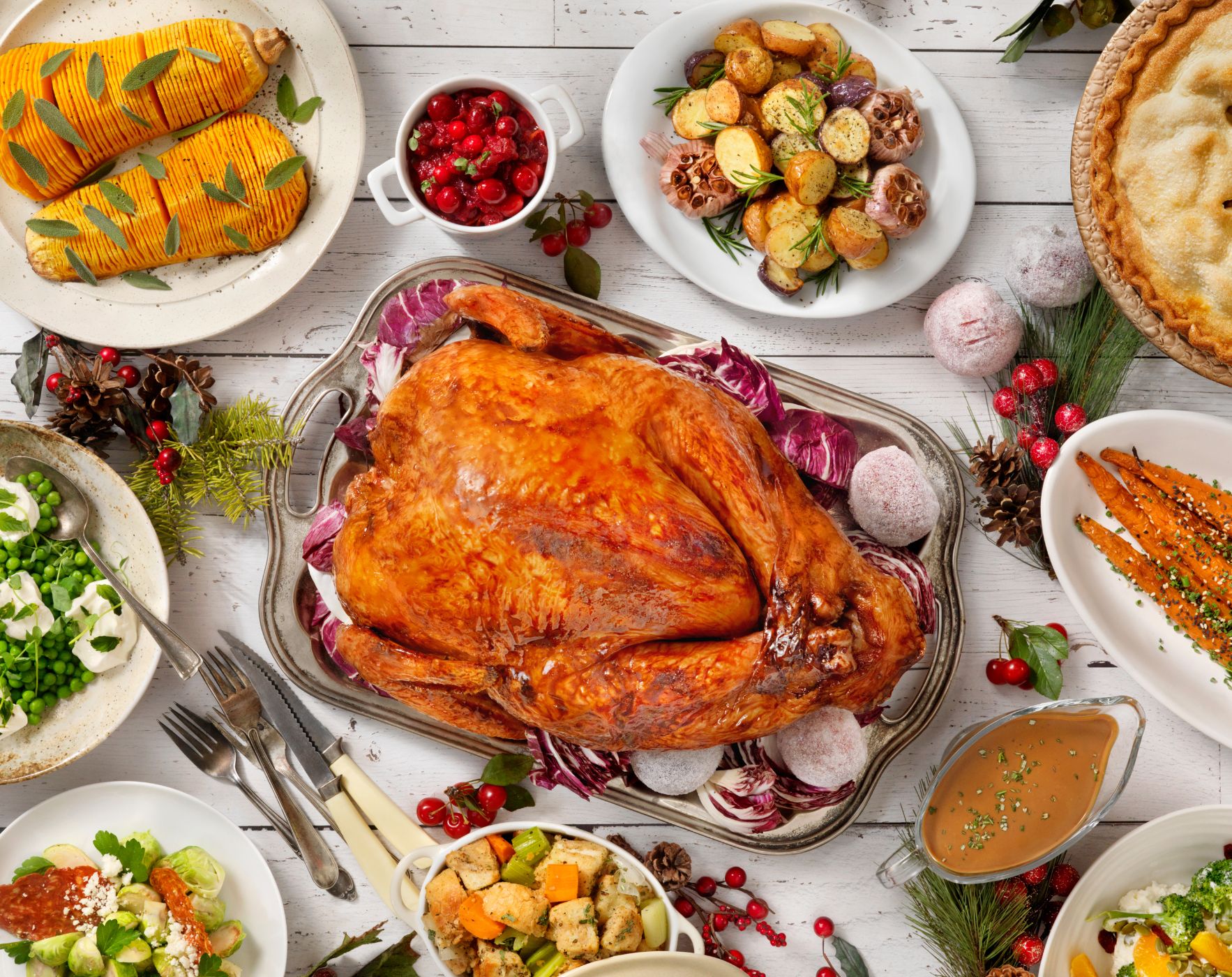 A Thanksgiving dinner table spread with a question mark, representing the dilemma of staying on an MS diet during holiday feasts.