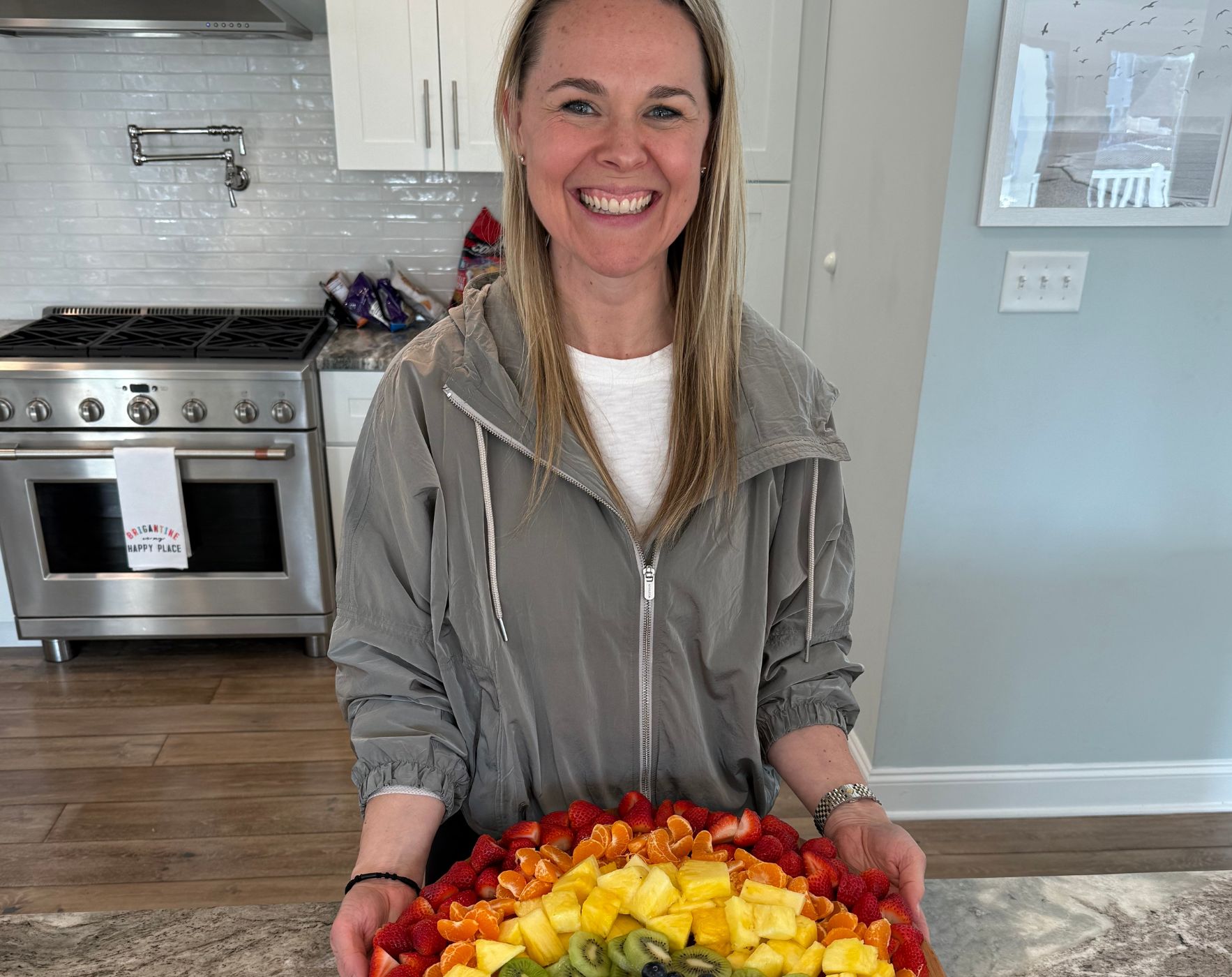 A person laughing or smiling while engaging in a simple, joyful activity, illustrating ways to bring lightness and fun back into an MS healing routine.