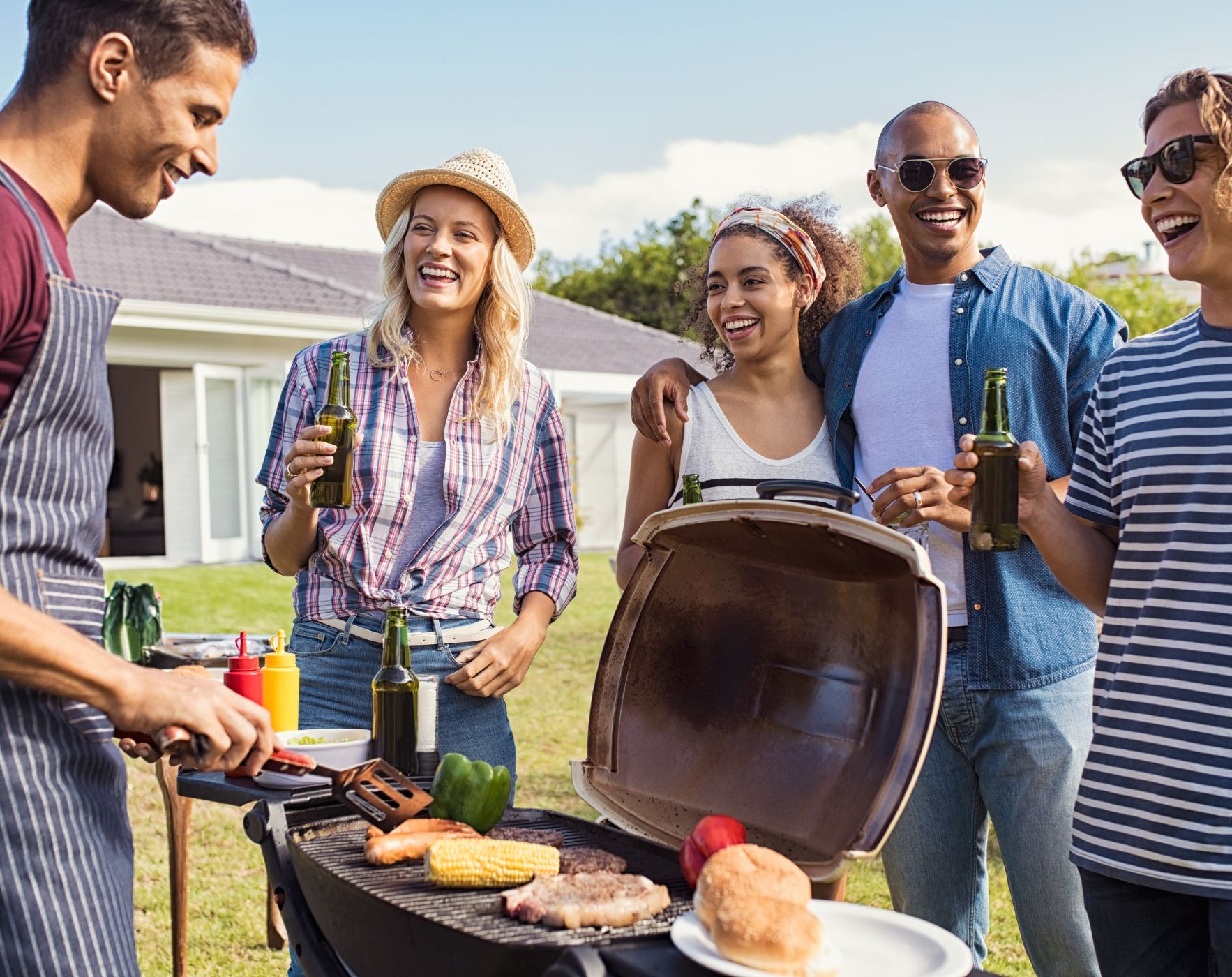 Alene Brennan smiling at an outdoor barbecue with healthy food options, symbolizing navigating social gatherings while following the Wahls Protocol for Multiple Sclerosis.