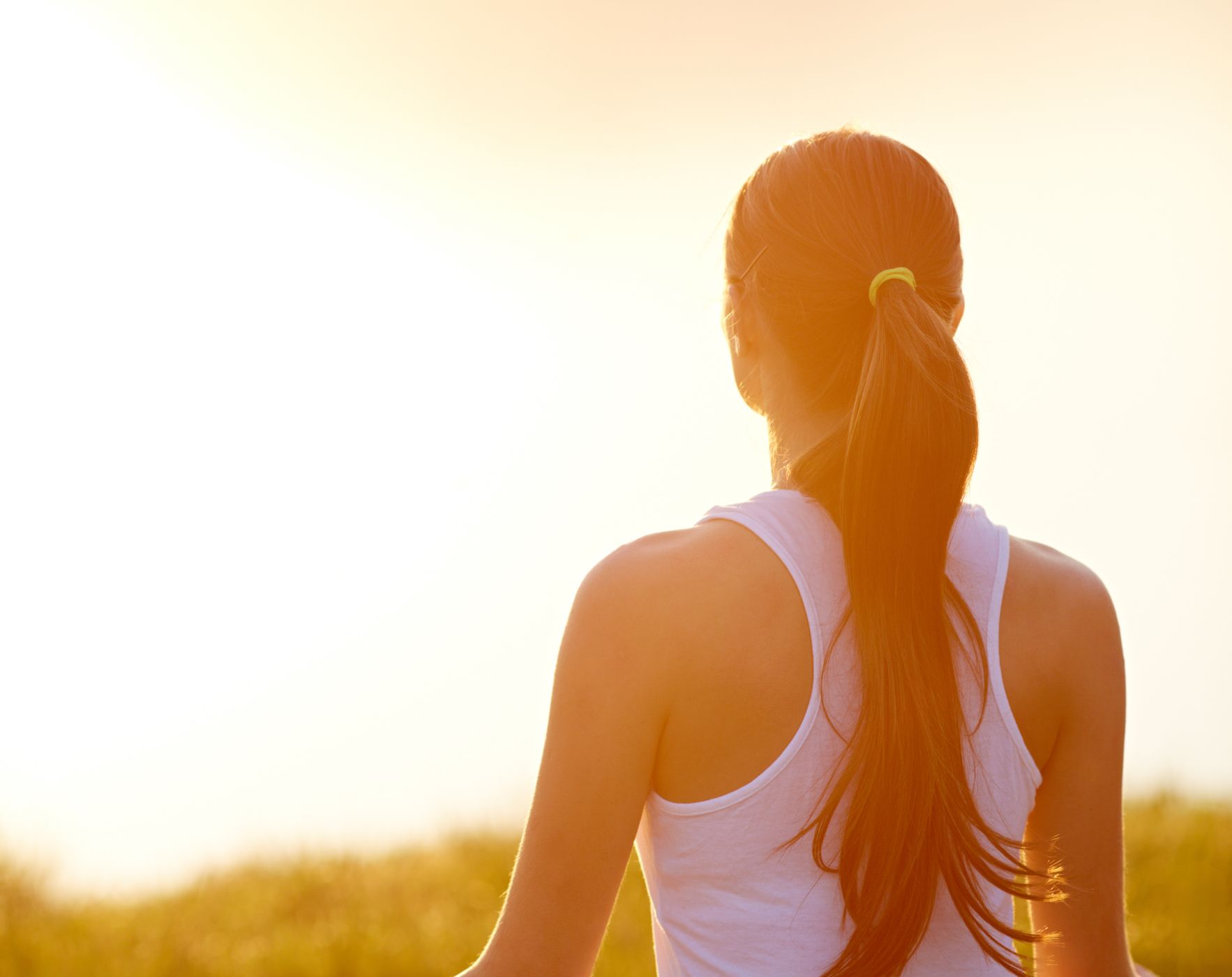 Alene Brennan looking energetic and vibrant, surrounded by icons of healthy habits like exercise and nutritious food, representing 7 daily tricks to boost energy and ease Multiple Sclerosis fatigue.