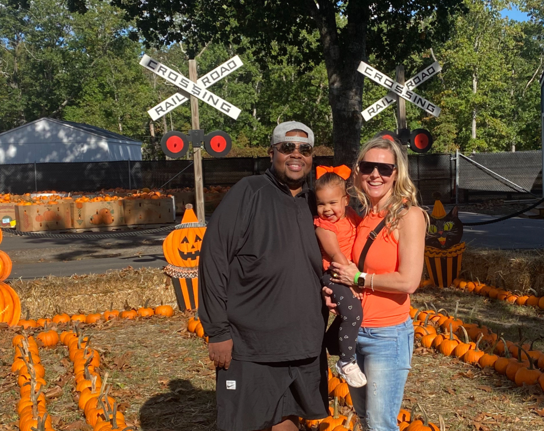 Wahls Protocol Practitioner Alene Brennan and family at a pumpkin patch in fall, smiling together among pumpkins and Halloween decorations representing MS holiday fatigue tips and healthy fall habits.